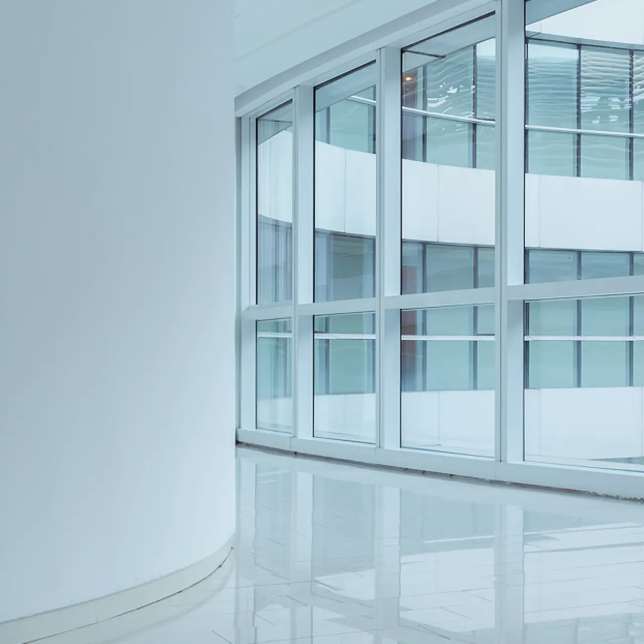 Round window within a modern building complex